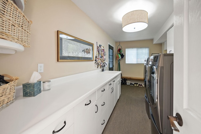 35AND33 Lakeside Ave, Lakeside, MT 59922 - laundry room featuring washer and clothes dryer, cabinet space, and dark colored carpet