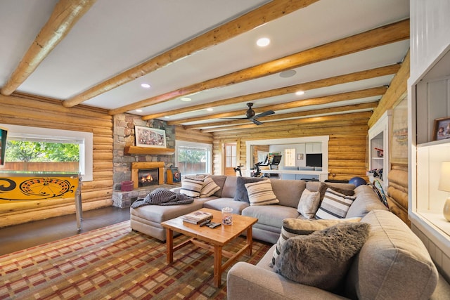 35AND33 Lakeside Ave, Lakeside, MT 59922 - living area with recessed lighting, a stone fireplace, log walls, beam ceiling, and wood finished floors