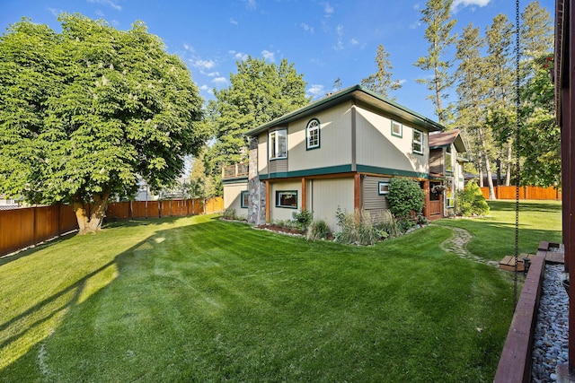 35AND33 Lakeside Ave, Lakeside, MT 59922 - rear view of house with a fenced backyard