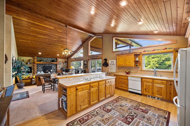 35AND33 Lakeside Ave, Lakeside, MT 59922 - kitchen with white appliances, open shelves, wooden ceiling, light countertops, and a center island