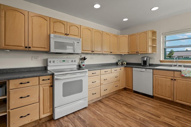 91 Denver Ave, Kalispell, MT 59901 - kitchen with white appliances, light brown cabinetry, dark countertops, wood finished floors, and recessed lighting