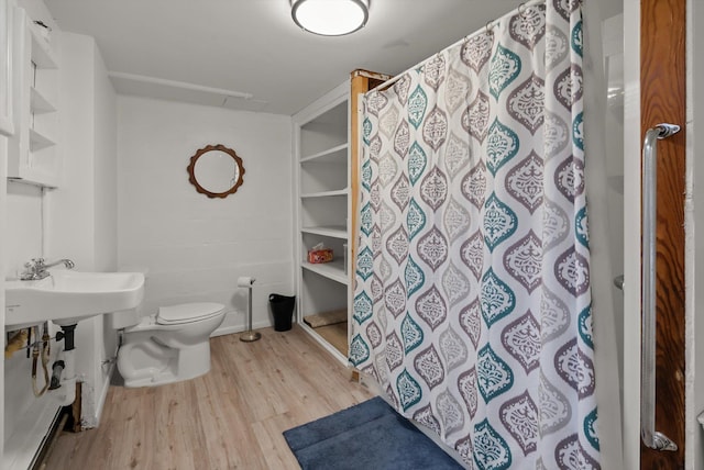 91 Denver Ave, Kalispell, MT 59901 - bathroom with wood finished floors and a shower with shower curtain