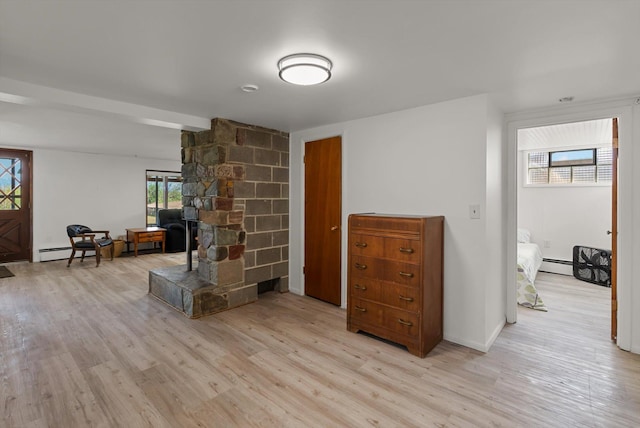 91 Denver Ave, Kalispell, MT 59901 - living area with light wood-style flooring and a baseboard radiator