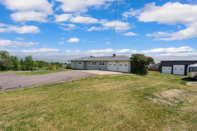 91 Denver Ave, Kalispell, MT 59901 - view of front facade with a front yard and a garage