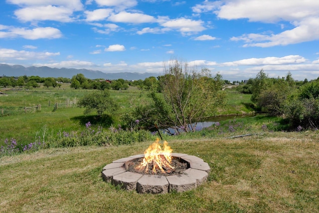 91 Denver Ave, Kalispell, MT 59901 - view of yard with a fire pit and a mountain view
