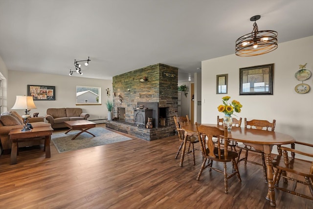 91 Denver Ave, Kalispell, MT 59901 - dining space featuring wood finished floors and a large fireplace