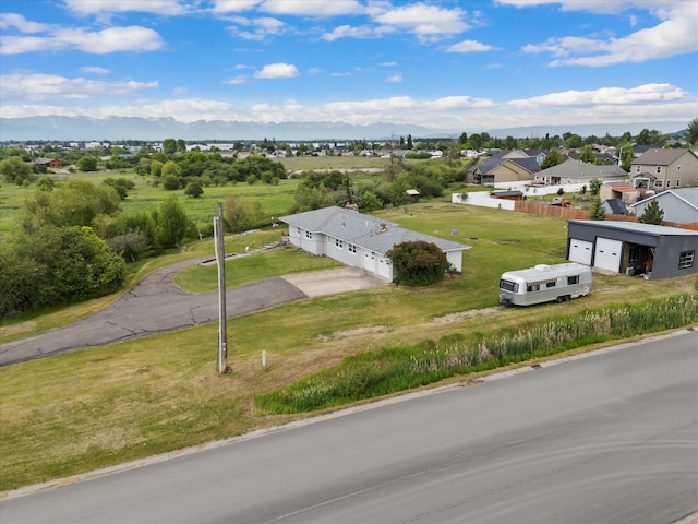 91 Denver Ave, Kalispell, MT 59901 - aerial perspective of suburban area featuring a mountainous background