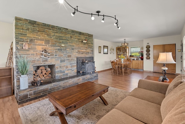 91 Denver Ave, Kalispell, MT 59901 - living area featuring wood finished floors and a wood stove