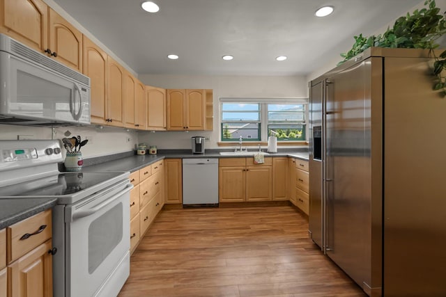 91 Denver Ave, Kalispell, MT 59901 - kitchen featuring white appliances, light brown cabinetry, light wood-style floors, recessed lighting, and dark countertops