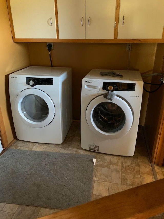 8325 Thunder Rd, Lincoln, MT 59639 - laundry room with cabinet space, separate washer and dryer, and light stone finish flooring