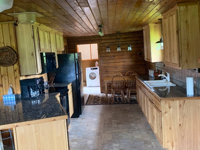 8325 Thunder Rd, Lincoln, MT 59639 - kitchen with washer / dryer, black microwave, wood ceiling, dark countertops, and wood walls