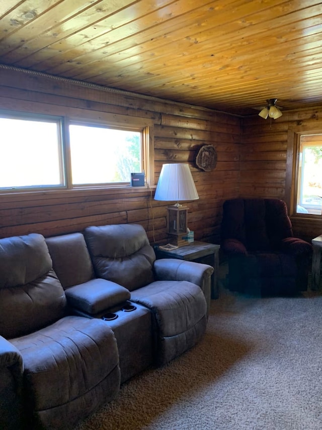 8325 Thunder Rd, Lincoln, MT 59639 - carpeted living room with rustic walls, wood ceiling, and ceiling fan