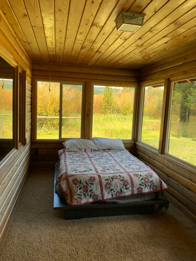 8325 Thunder Rd, Lincoln, MT 59639 - carpeted bedroom with wooden ceiling and log walls