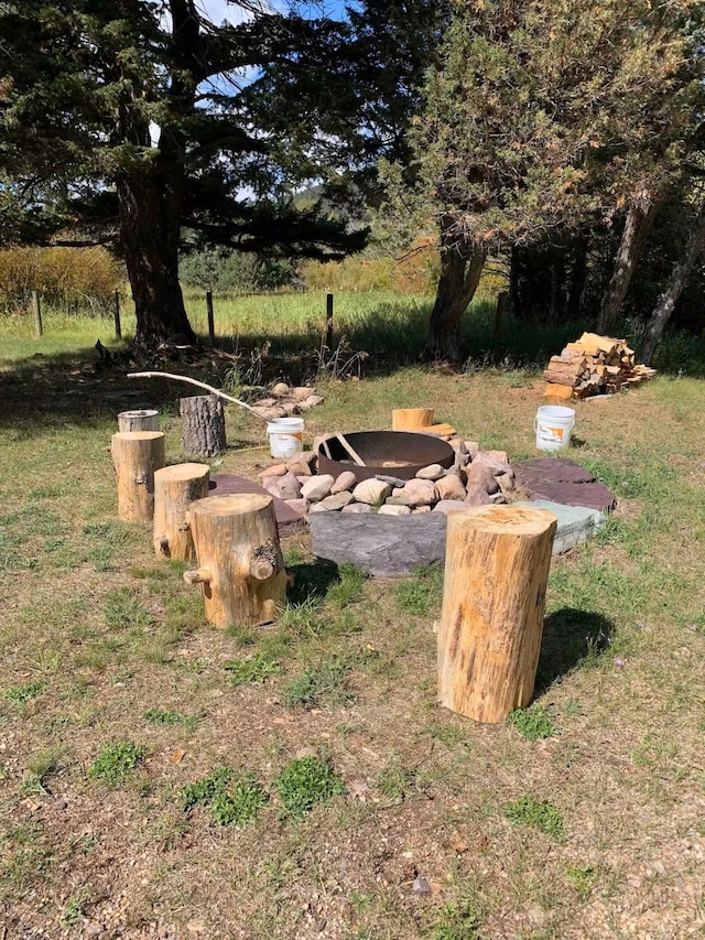 8325 Thunder Rd, Lincoln, MT 59639 - view of yard featuring an outdoor fire pit