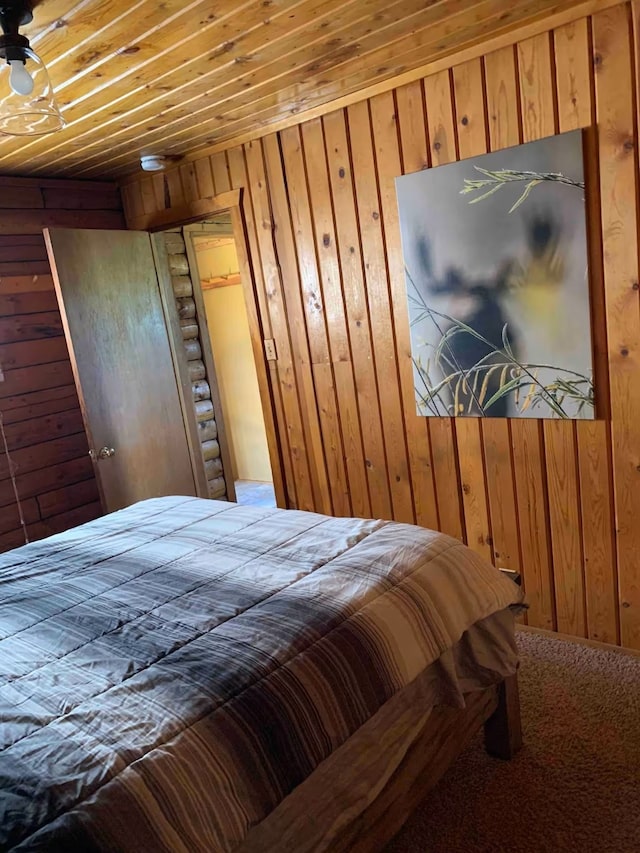 8325 Thunder Rd, Lincoln, MT 59639 - carpeted bedroom featuring wooden walls and wood ceiling
