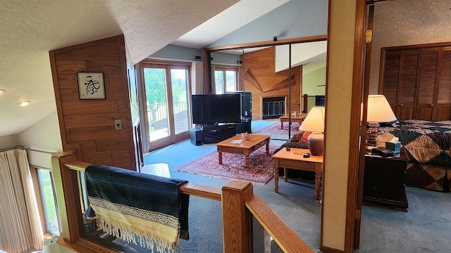 122 Fairway Blvd, Kalispell, MT 59901 - living room with vaulted ceiling, carpet flooring, and a textured ceiling