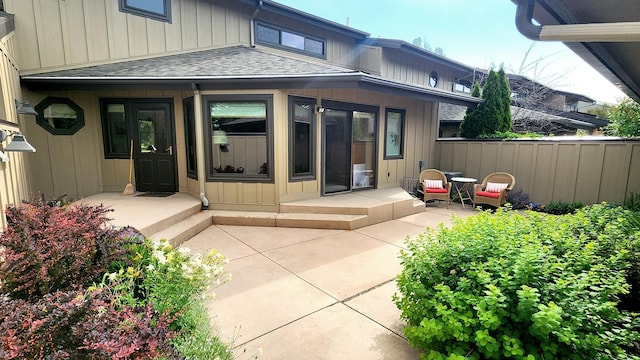 122 Fairway Blvd, Kalispell, MT 59901 - back of property with roof with shingles and a patio