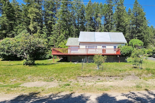 21439 Rollins Lakeshore Dr, Rollins, MT 59931 - back of property featuring a wooden deck