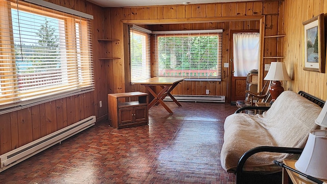 21439 Rollins Lakeshore Dr, Rollins, MT 59931 - living area featuring baseboard heating, wooden walls, and plenty of natural light