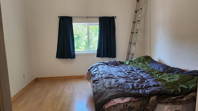21439 Rollins Lakeshore Dr, Rollins, MT 59931 - bedroom with wood finished floors and baseboards