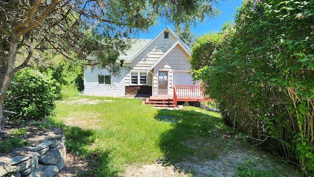 21439 Rollins Lakeshore Dr, Rollins, MT 59931 - back of house with a deck and a yard