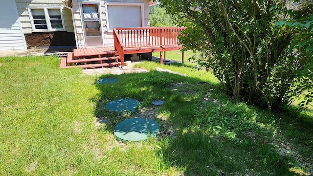 21439 Rollins Lakeshore Dr, Rollins, MT 59931 - view of grassy yard with a wooden deck
