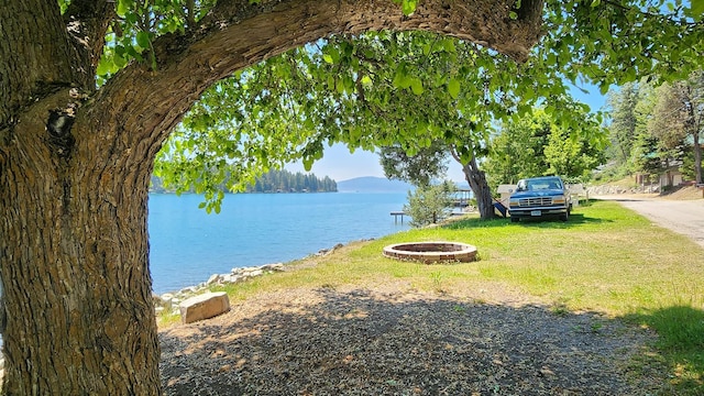 21439 Rollins Lakeshore Dr, Rollins, MT 59931 - water view with an outdoor fire pit