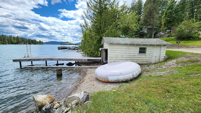 21439 Rollins Lakeshore Dr, Rollins, MT 59931 - dock featuring a water view
