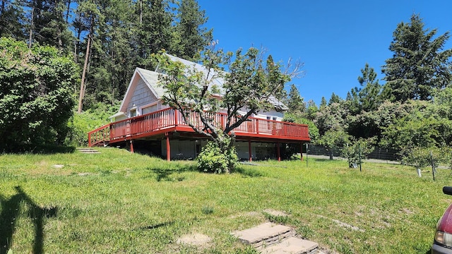 21439 Rollins Lakeshore Dr, Rollins, MT 59931 - view of yard featuring a wooden deck