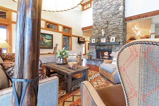 349 Harlan Creek Rd, Hamilton, MT 59840 - living room featuring a towering ceiling, wood finished floors, and a fireplace