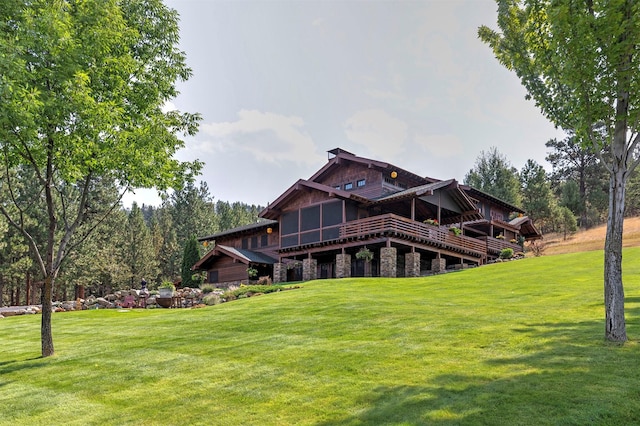 349 Harlan Creek Rd, Hamilton, MT 59840 - rear view of property with a yard, stone siding, and a wooden deck
