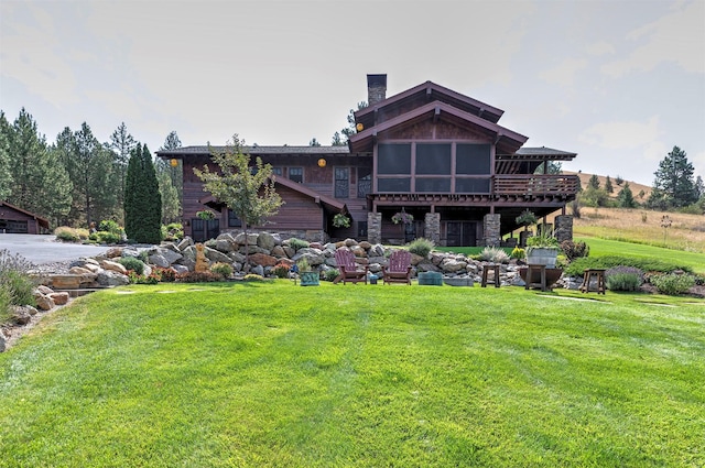 349 Harlan Creek Rd, Hamilton, MT 59840 - back of house featuring a yard and stone siding