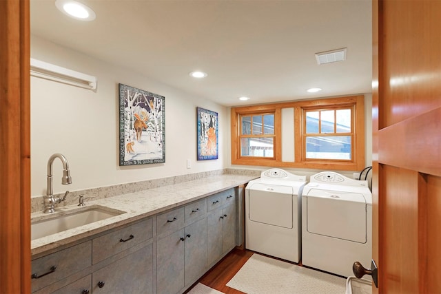 349 Harlan Creek Rd, Hamilton, MT 59840 - laundry area featuring washing machine and dryer, cabinet space, dark wood-style flooring, and recessed lighting