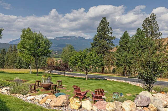 349 Harlan Creek Rd, Hamilton, MT 59840 - surrounding community with a mountain view and a lawn