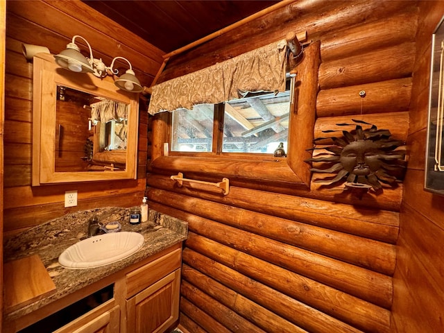 17 Twenty Peak Gulch Ln, Trout Creek, MT 59874 - bathroom featuring vanity, wood ceiling, and log walls