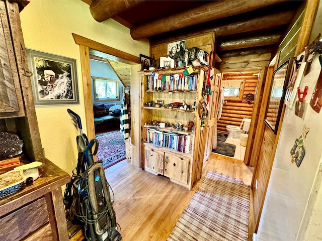 17 Twenty Peak Gulch Ln, Trout Creek, MT 59874 - corridor with rustic walls, light wood finished floors, beamed ceiling, and a textured wall