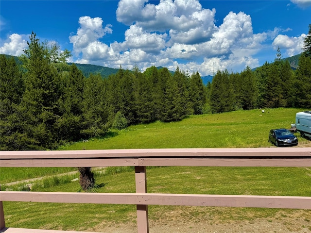 17 Twenty Peak Gulch Ln, Trout Creek, MT 59874 - view of green lawn with a wooded view and a mountain view