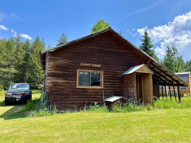 17 Twenty Peak Gulch Ln, Trout Creek, MT 59874 - view of side of home featuring a yard
