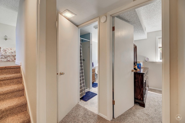 3875 Kiki Dr Unit 3875, Helena, MT 59602 - corridor with a textured ceiling, carpet floors, and stairs