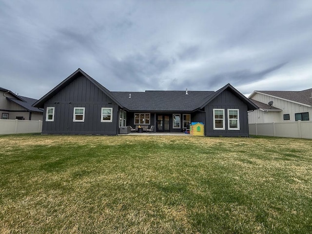 123 Owl Loop, Kalispell, MT 59901 - back of house featuring board and batten siding, a patio, and roof with shingles