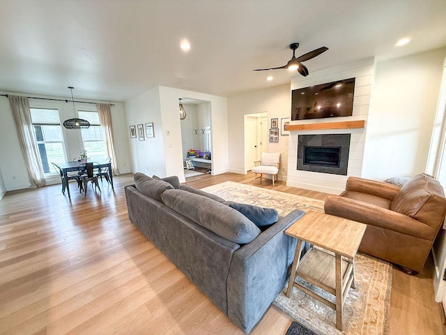 123 Owl Loop, Kalispell, MT 59901 - living room with ceiling fan, light wood-style flooring, a fireplace, and recessed lighting