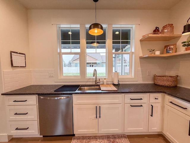 123 Owl Loop, Kalispell, MT 59901 - kitchen featuring dishwasher, white cabinetry, dark stone countertops, and decorative backsplash
