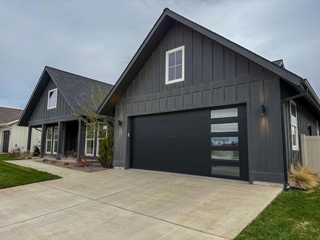 123 Owl Loop, Kalispell, MT 59901 - modern farmhouse featuring board and batten siding, an attached garage, and concrete driveway