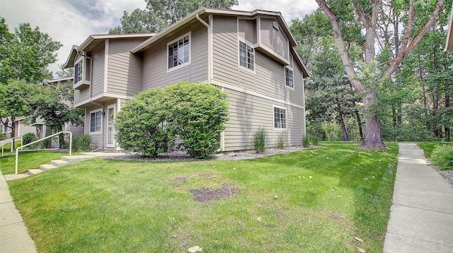 5530 Creekstone Dr Unit 6, Missoula, MT 59808 - view of property exterior featuring a lawn