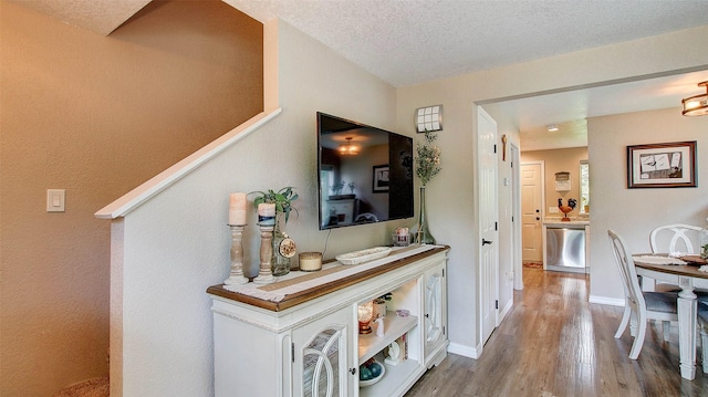 5530 Creekstone Dr Unit 6, Missoula, MT 59808 - hallway featuring wood finished floors and a textured ceiling
