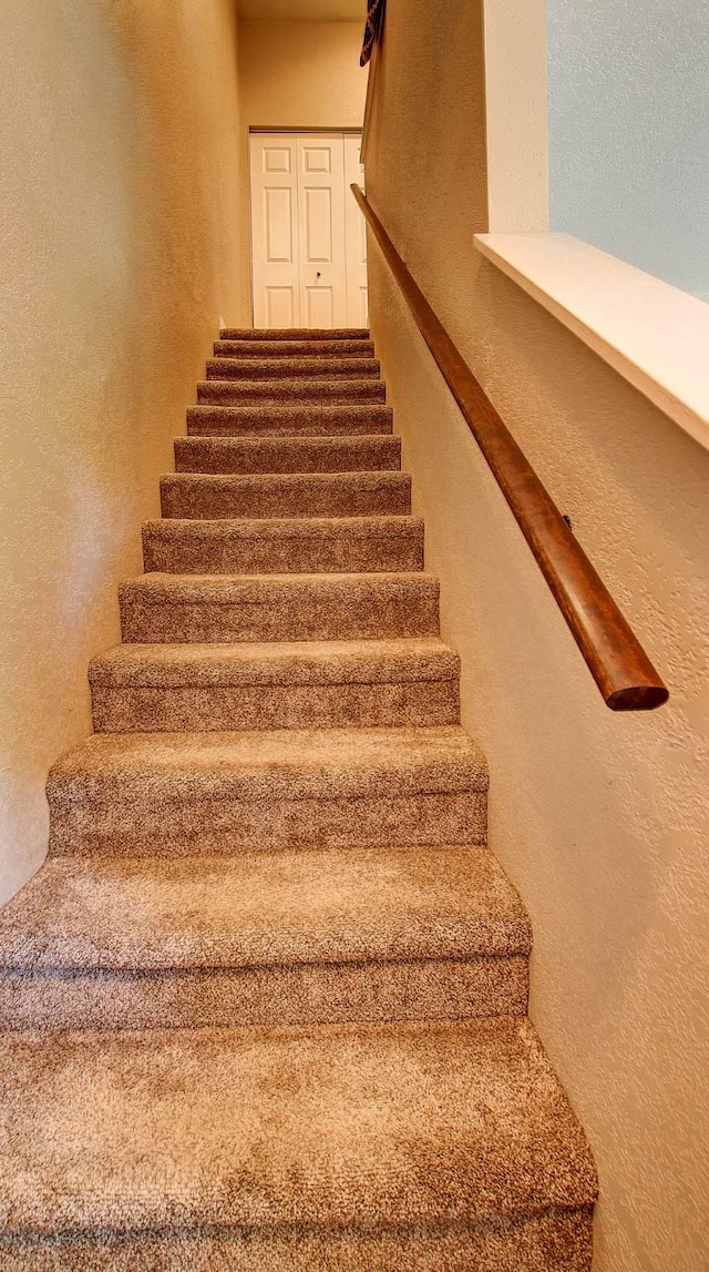 5530 Creekstone Dr Unit 6, Missoula, MT 59808 - staircase with a textured wall