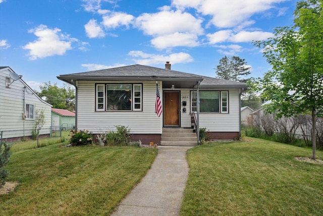 321 6th Ave W, Kalispell, MT 59901 - bungalow-style house with a chimney, entry steps, and a shingled roof