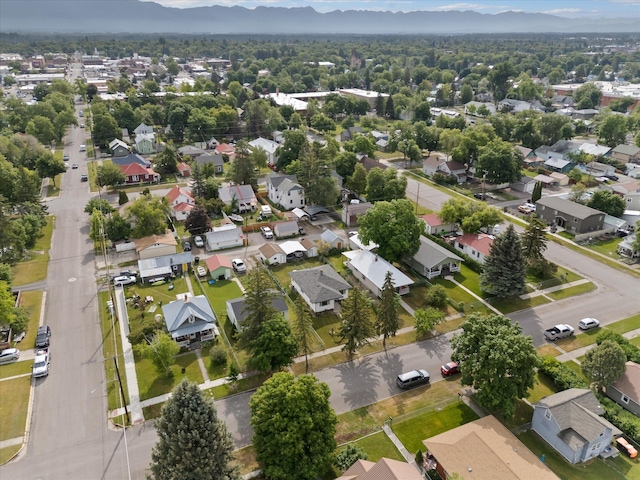 321 6th Ave W, Kalispell, MT 59901 - aerial overview of property's location featuring a mountain backdrop and nearby suburban area