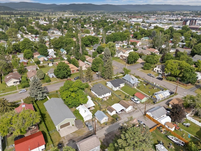 321 6th Ave W, Kalispell, MT 59901 - aerial view of property and surrounding area featuring a mountain backdrop and nearby suburban area