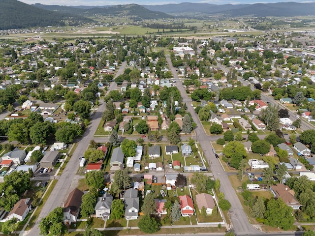 321 6th Ave W, Kalispell, MT 59901 - aerial overview of property's location featuring a mountainous background and nearby suburban area